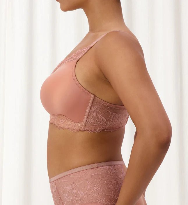 Side angle of The Foundation’s Amourette Charm Wire-Free Bra in Rust, styled with matching brief for a feminine look.