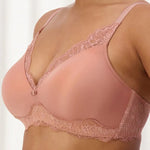 Side view of The Foundation's Amourette Charm Bra in Rust, featuring smooth lace cups and supportive straps.