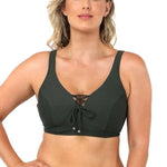 Model wearing Baku Rococco EFG Cup Bra Olive, an olive green underwire bra with lace-up front, convertible straps, and supportive full coverage, available at The Foundation.