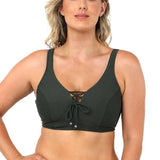 Model wearing Baku Rococco EFG Cup Bra Olive, an olive green underwire bra with lace-up front, convertible straps, and supportive full coverage, available at The Foundation.