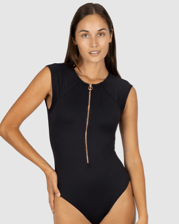 Women in black one piece zip front swimsuit with cap sleeves