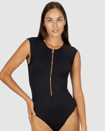 Women in black one piece zip front swimsuit with cap sleeves