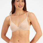 Model wearing Berlei Barely There Contour Bra Skin – seamless, comfy t-shirt bra with full-cup support.