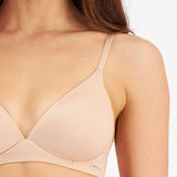 Close up of Berlei Understate Wirefree Bra Nude—soft neckline and smooth lines for seamless wear under clothes.
