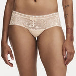Model wearing Chantelle Day To Night Shorty Brief in Golden Beige, featuring delicate lace detailing, soft mesh lining, and a flattering hipster cut. front