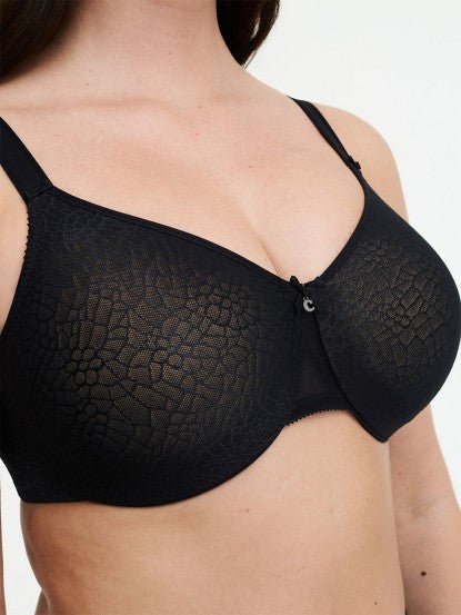 Model wearing Chantelle’s C Magnifique Moulded Bra in Black from The Foundation, featuring full-coverage cups and a smoothing mesh back band. close up