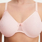 Model in Chantelle C Magnifique Moulded Bra in Rose from The Foundation, showcasing full-coverage cups and supportive smoothing mesh back. close up view