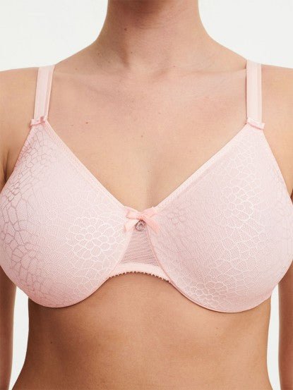 Model in Chantelle C Magnifique Moulded Bra in Rose from The Foundation, showcasing full-coverage cups and supportive smoothing mesh back. close up view