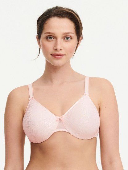 Model in Chantelle C Magnifique Moulded Bra in Rose from The Foundation, showcasing full-coverage cups and supportive smoothing mesh back.