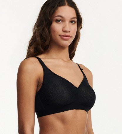 Side profile of C Magnifique Black wireless bra showing smooth silhouette and lightly padded adjustable straps.