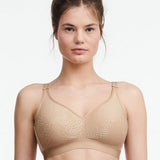 Front view of Chantelle C Magnifique Non Wire Bra in Nude featuring floral jacquard cups and adjustable straps.