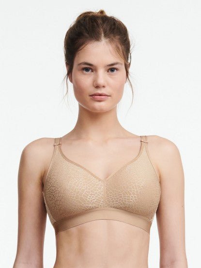 Front view of Chantelle C Magnifique Non Wire Bra in Nude featuring floral jacquard cups and adjustable straps.