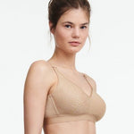 Side angle of  Chantelle C Magnifique wireless nude bra in a soft matte-shine floral knit, offering full bust support.
