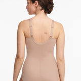 Back view of Chantelle Hedona Bodysuit Nude on model, highlighting medium control shaping and invisible seams, available at The Foundation.