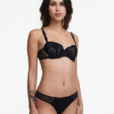 Model wears the full black lace set from The Foundation, featuring the Champs Elysees Half Cup Bra with matching brief.