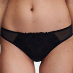Close up of The Foundation’s Champs Elysées Tanga Brief in Black, featuring sheer embroidered mesh and a flattering low-rise fit.