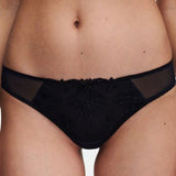 Close up of The Foundation’s Champs Elysées Tanga Brief in Black, featuring sheer embroidered mesh and a flattering low-rise fit.