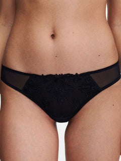 Close up of The Foundation’s Champs Elysées Tanga Brief in Black, featuring sheer embroidered mesh and a flattering low-rise fit.