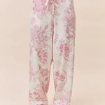 Papinelle Coco Feather Soft PJ Set in Pink and Ecru, featuring a long sleeve scoop neck top and relaxed wide-leg floral pants – available at The Foundation.