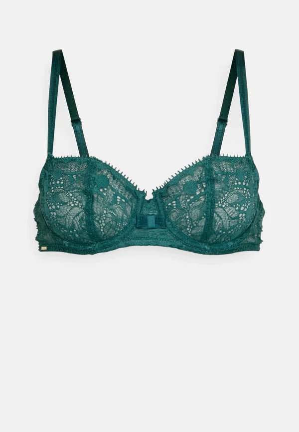 Flat lay of Chantelle Day to Night Half Cup Bra in green lace – demi cut lingerie from The Foundation