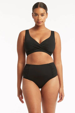 Sea Level Essentials Gathered Side High Waist Swim Pant in Black with ruched sides, high rise waist, and full bottom coverage – available at The Foundation