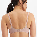 Studio back view of Electrify Mesh Underwire Sports Bra Soft Powder, showing adjustable straps and fit from The Foundation.