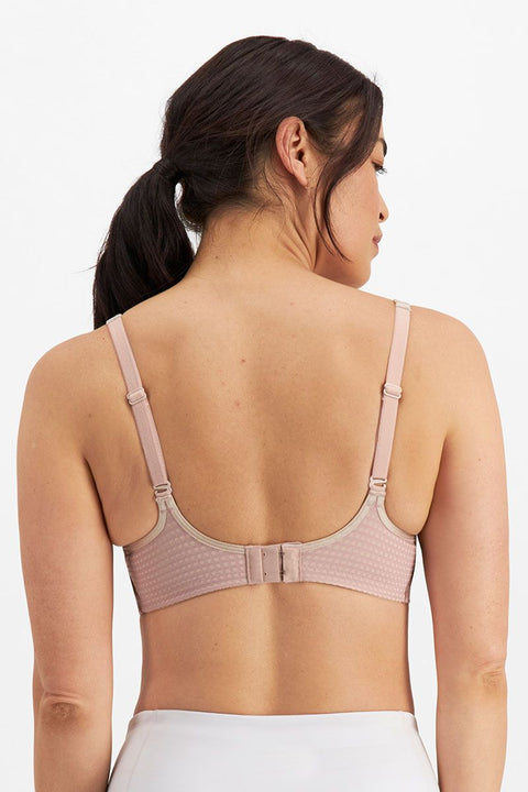 Studio back view of Electrify Mesh Underwire Sports Bra Soft Powder, showing adjustable straps and fit from The Foundation.