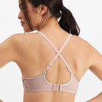 Back view of Electrify Mesh Underwire Sports Bra Soft Powder, displaying supportive cross-back straps from The Foundation.