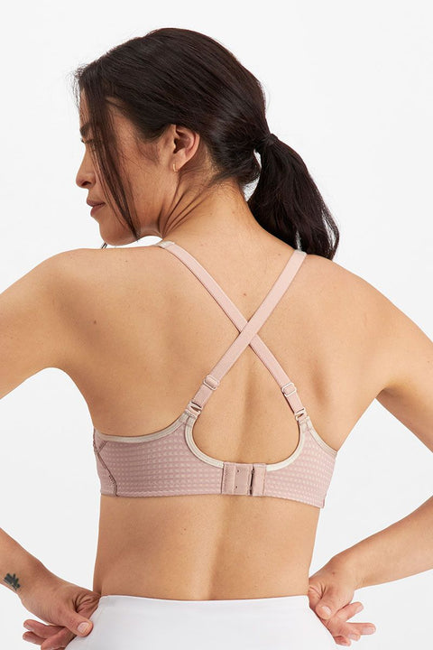 Back view of Electrify Mesh Underwire Sports Bra Soft Powder, displaying supportive cross-back straps from The Foundation.