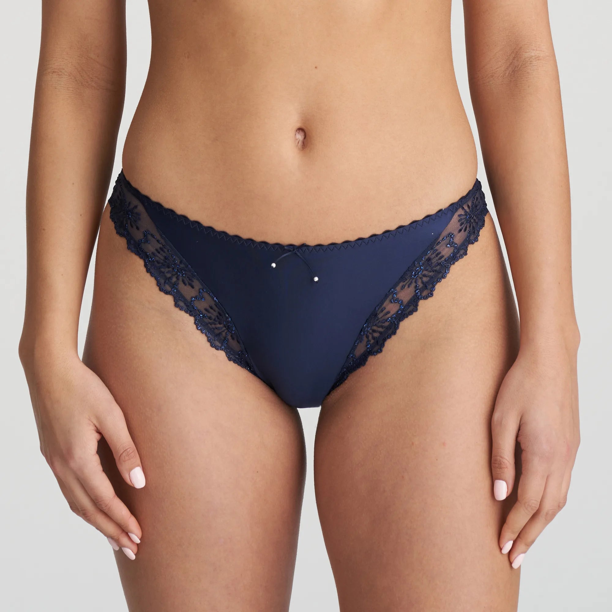 Model wearing the Jane Italian Brief in Velvet Blue with sheer floral embroidery and velvet waistband.