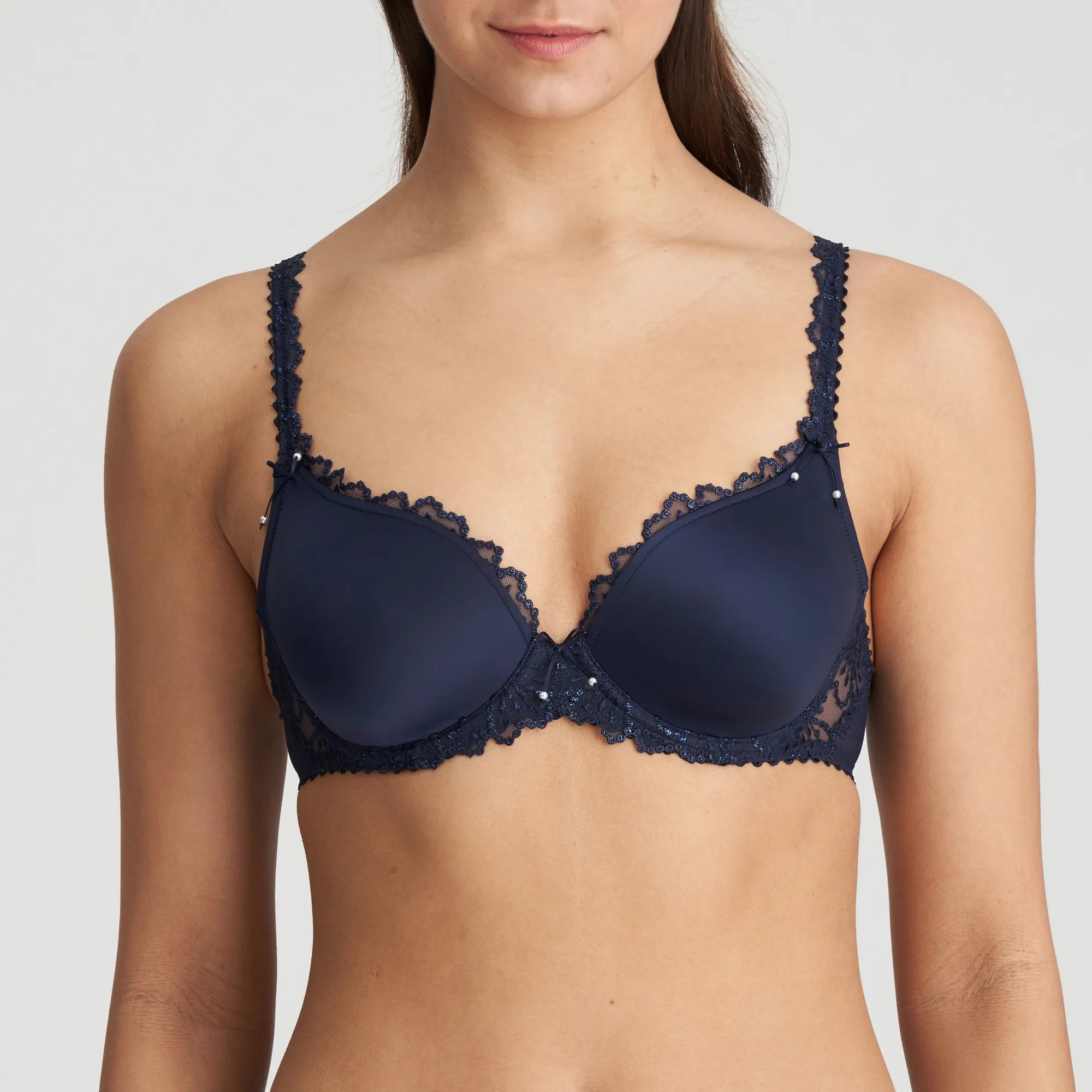 Model wearing the Jane Padded Heart Shape Bra in Velvet Blue, highlighting the deep plunge neckline and embroidered cups.
