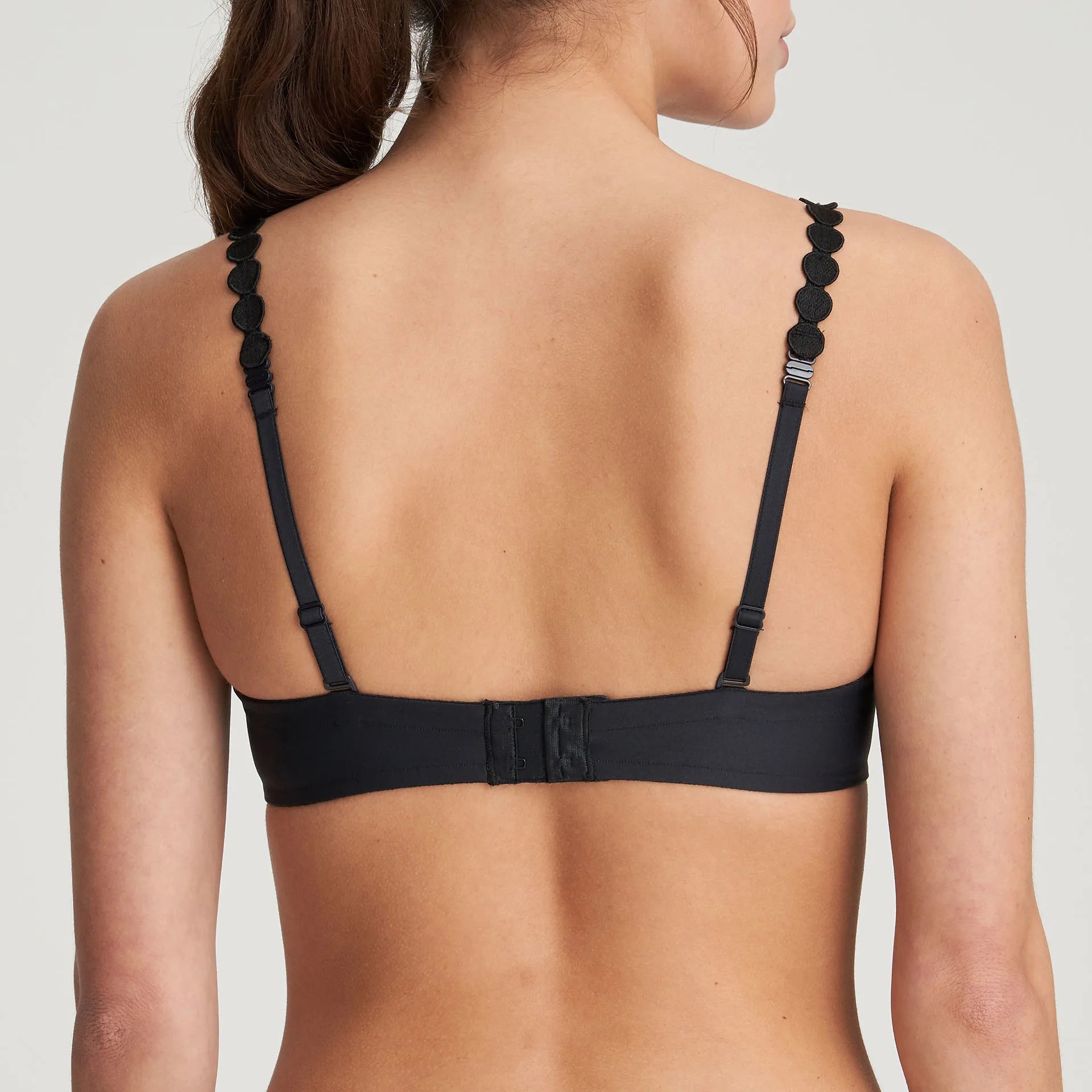Back view of Tom Padded Balcony Bra in Charcoal, showing adjustable straps and secure clasp design.