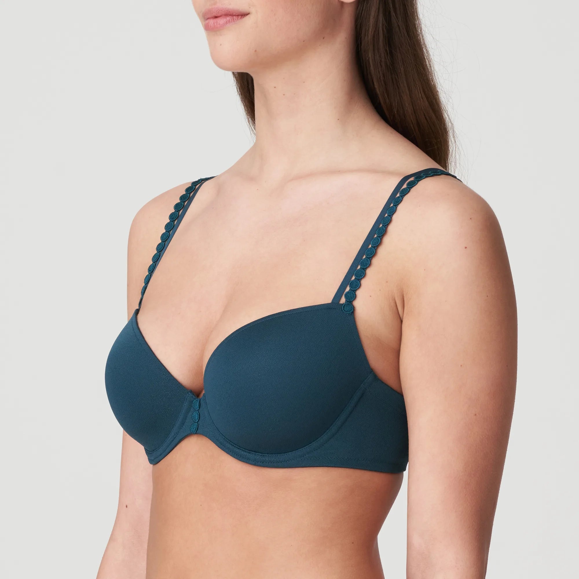 Side angle of Tom Mini Padded Plunge Bra in dark green, highlighting flirty plunge shape and textured fabric