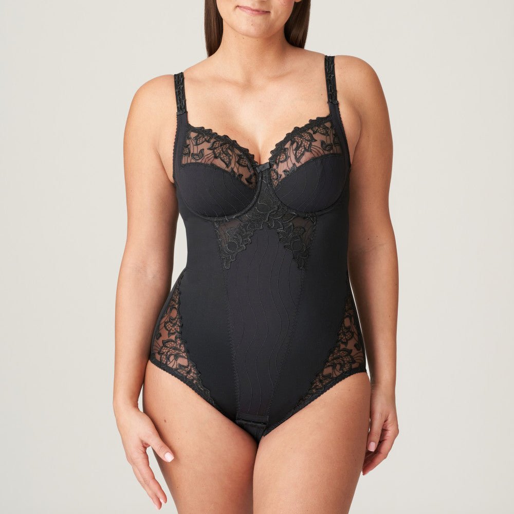 Front view of the PrimaDonna Deauville Bodysuit in Black, with lace cups and smoothing shape, available at The Foundation.