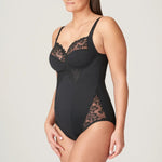 Angled view of model wearing the Deauville Black Bodysuit, highlighting bust support and shaping silhouette, from The Foundation.