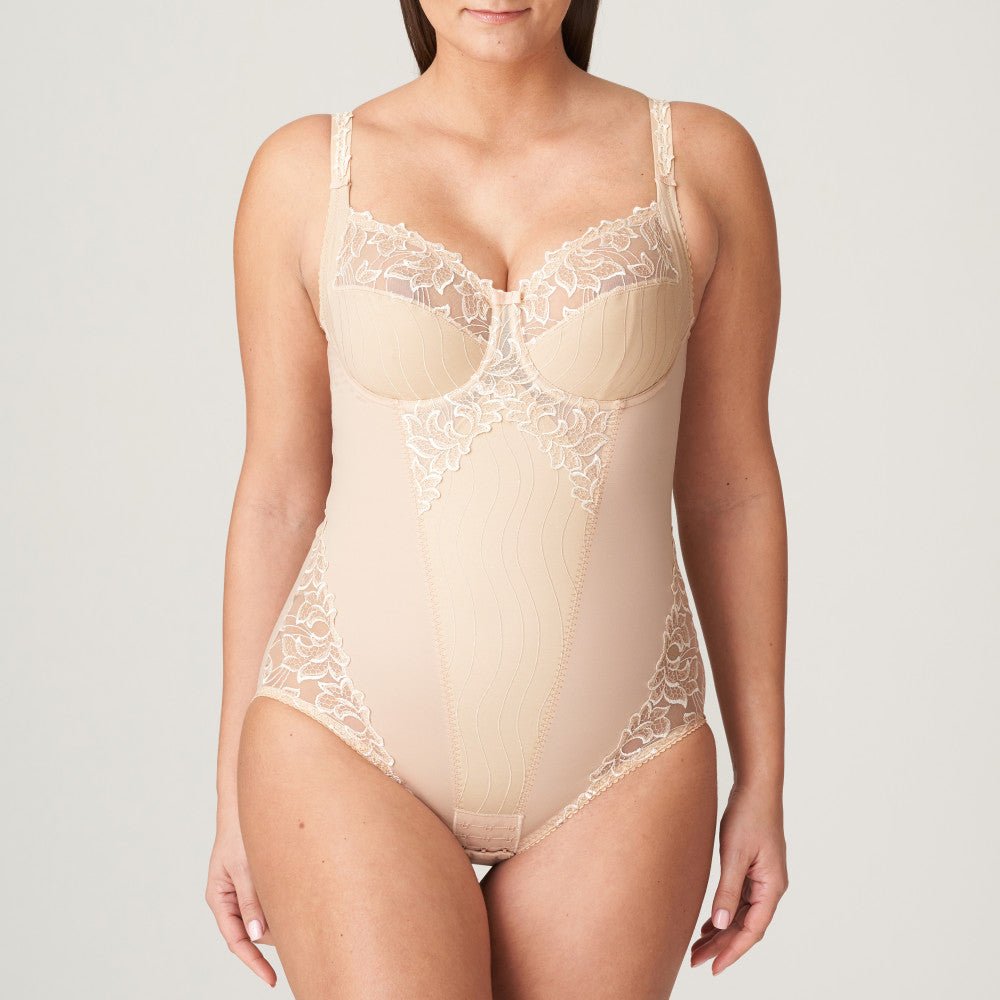 Front view of the PrimaDonna Deauville Bodysuit in Café Latte, featuring full coverage, underwire cups and soft lace, available at The Foundation.