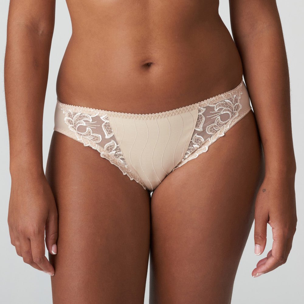 Front view of PrimaDonna Deauville Rio Brief Café Latte, featuring delicate embroidery and a flattering neutral tone.