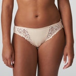 Front view of PrimaDonna Deauville Rio Brief Café Latte, featuring delicate embroidery and a flattering neutral tone.