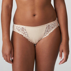 Front view of PrimaDonna Deauville Rio Brief Café Latte, featuring delicate embroidery and a flattering neutral tone.