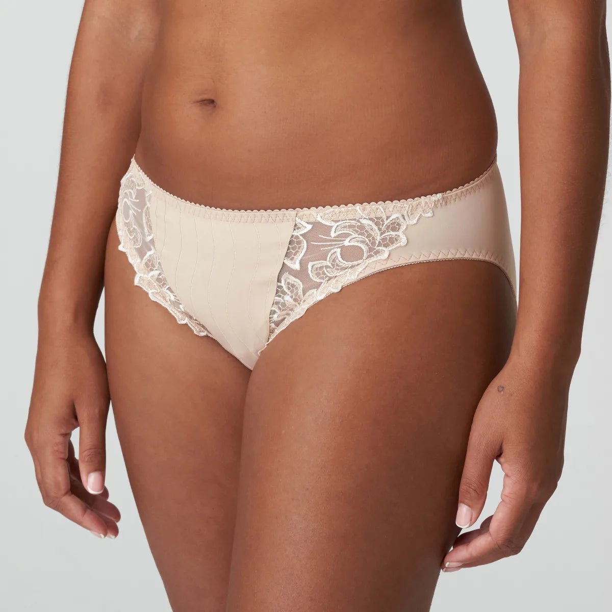 Side profile of Café Latte Deauville Rio Brief, showcasing mid-rise fit and detailed leg embroidery.
