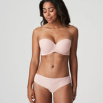 Model wearing Figuras Strapless Bra and brief set in Powder Rose – elegant and minimal full-body styling.