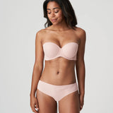 Model wearing Figuras Strapless Bra and brief set in Powder Rose – elegant and minimal full-body styling.