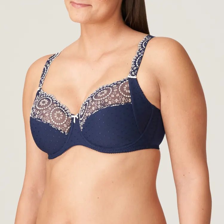 Side angle of Osino Full Cup Bra Sapphire Blue, highlighting eyelet lace detail on the straps and cups