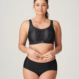 Model wearing The Game Sports Bra Black by PrimaDonna – full body shot showing supportive yet stylish activewear.