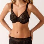 Front view of Model shown in the complete Melody set, featuring the seamless bra paired with the coordinating full brief in black lace.
