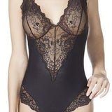 Front view of Model wearing Janira Greta IM Lace Bodysuit in Black, showcasing intricate lace detail and flattering silhouette.