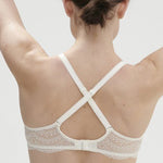 Cross-back strap styling on Karma 3D Plunge Bra by Simone Perele in natural, exclusive to The Foundation.