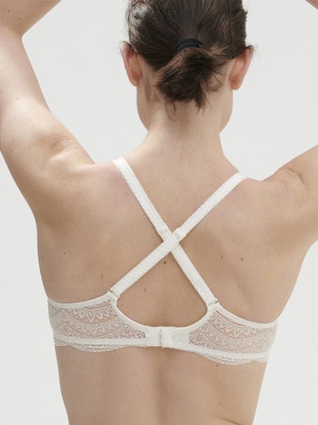 Cross-back strap styling on Karma 3D Plunge Bra by Simone Perele in natural, exclusive to The Foundation.