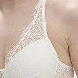 Detailed neckline shot of Karma Bra’s soft lace and 3D spacer cup in natural by Simone Perele—available from The Foundation. Close up