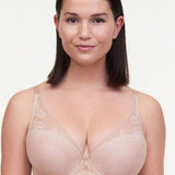 Model wearing Maddie Plunge T-Shirt Bra in Soft Pink with floral lace, showcasing a low plunge neckline.